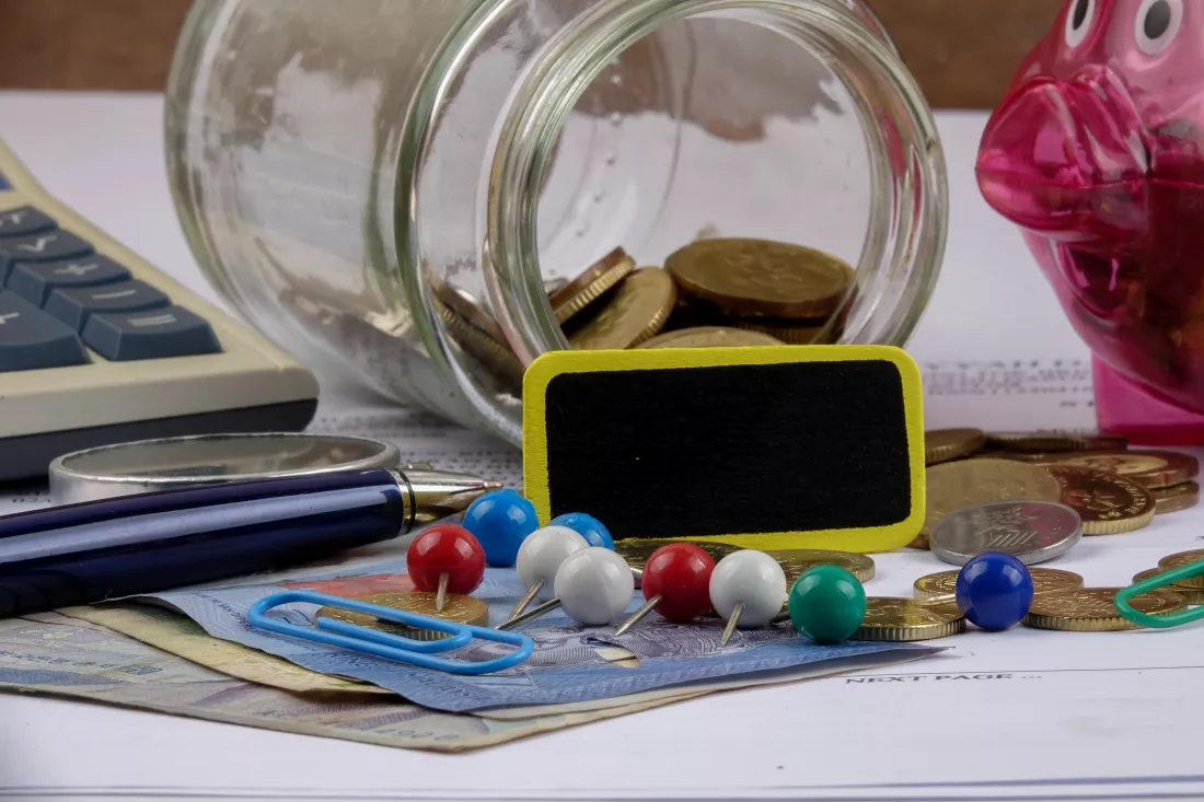 close-up-coins-with-office-supply-table